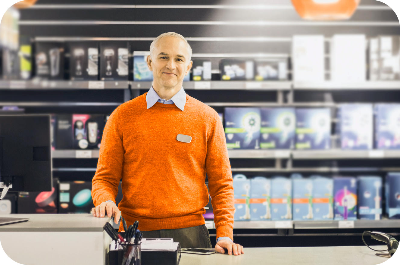 Worker standing at a counter in a store